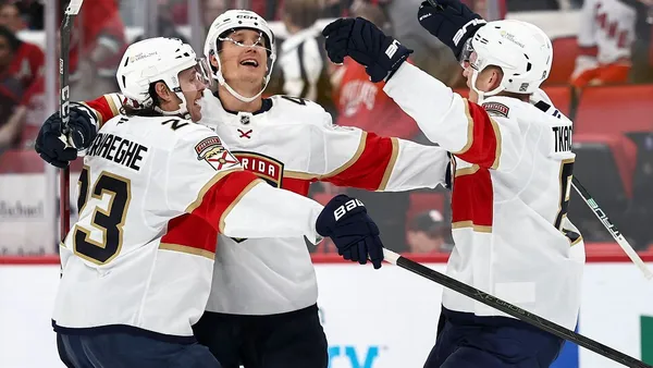img of Canes lift banner, Panthers win 'playoff-style' opener...