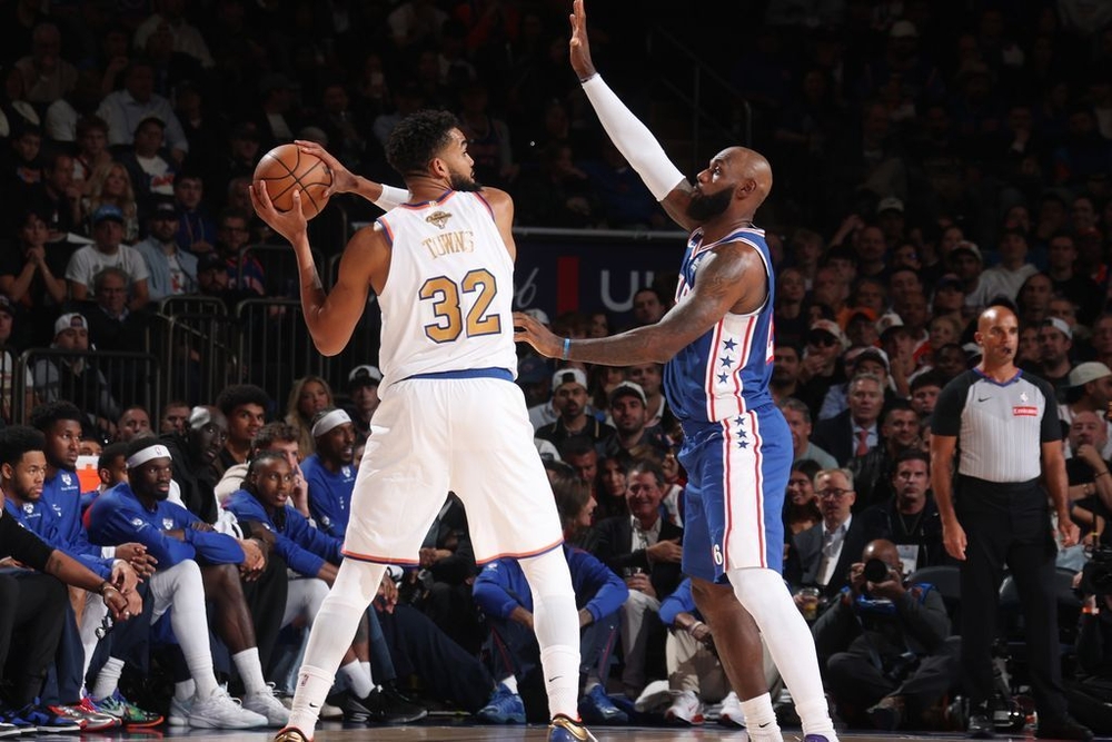 img of LeBron moonlights at center, helps limit Towns in...